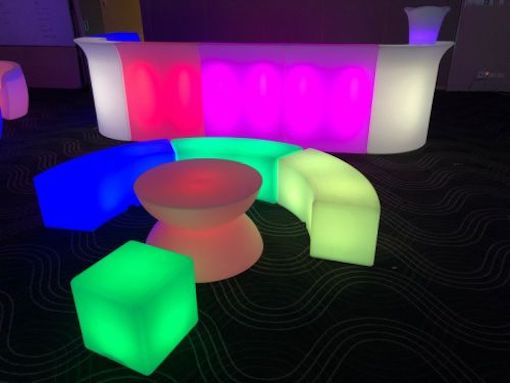 glow themed event with glow bars, glow coffee tables and glow benches