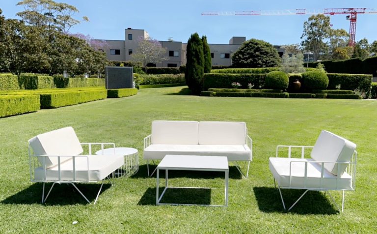 white velvet arm chair and sofa lounge paired with a white rectangular coffee table