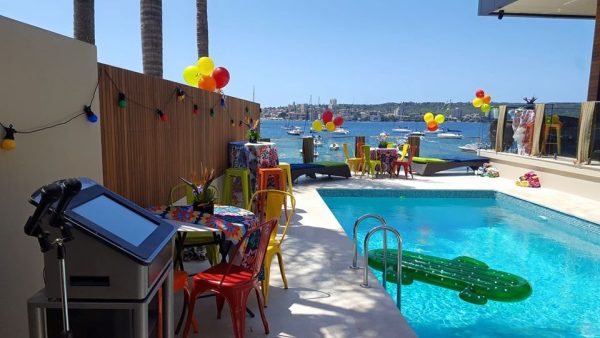 a pool party with an assort of coloured tolix chairs 