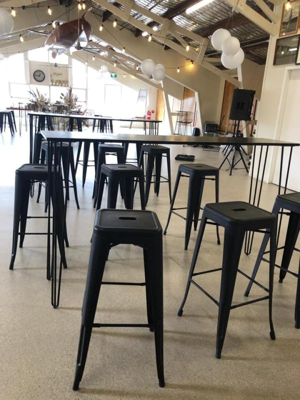 function with cocktail tables and black tolix stool set up 