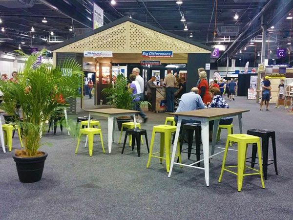 convention booths with lime and black tolix stools 