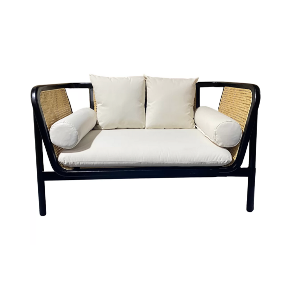 Black Rattan Sofa Lounge with white pillows