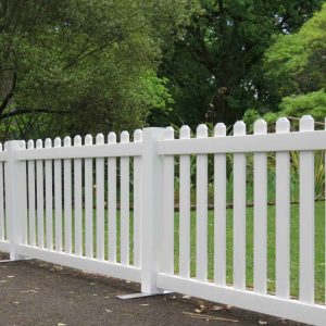 white picket fence placed outdoors