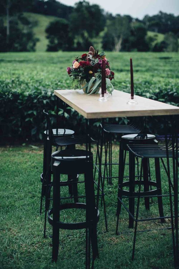 black hairpin tapas table with black ghost stools 