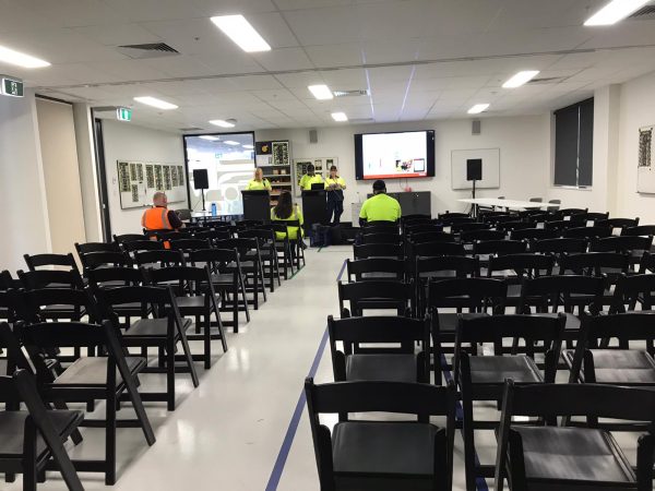 business event with black padded folding chairs 