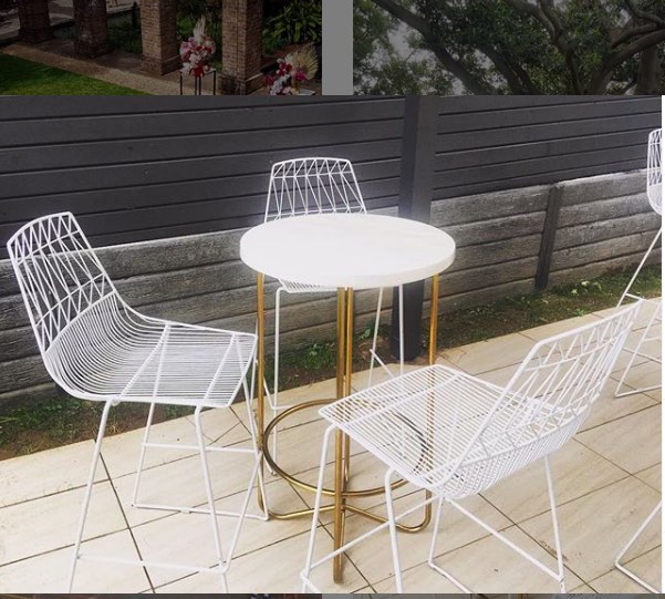 outdoor function with white wire stools and white marble cocktail table